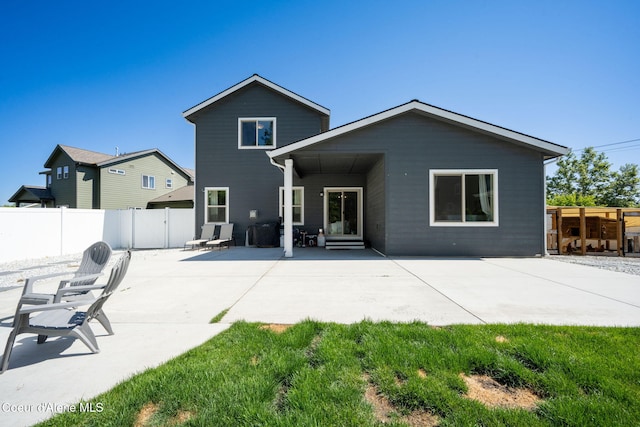 2499 N N Side Saddle Ln, Post Falls, ID 83854 - rear view of property with a fenced backyard and a patio