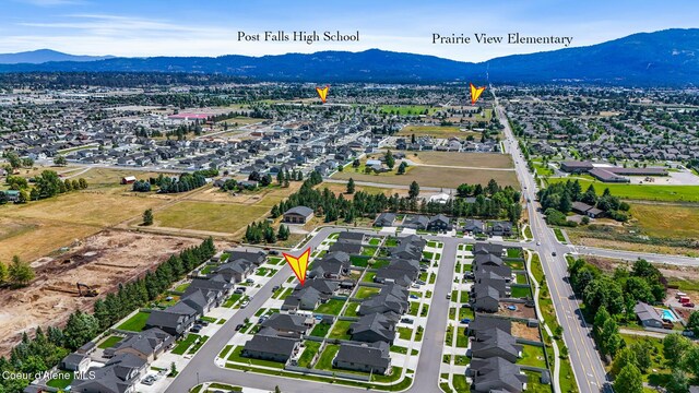 3631 N Britton Rd, Post Falls, ID 83854 - aerial view of property's location with a mountainous background and nearby suburban area
