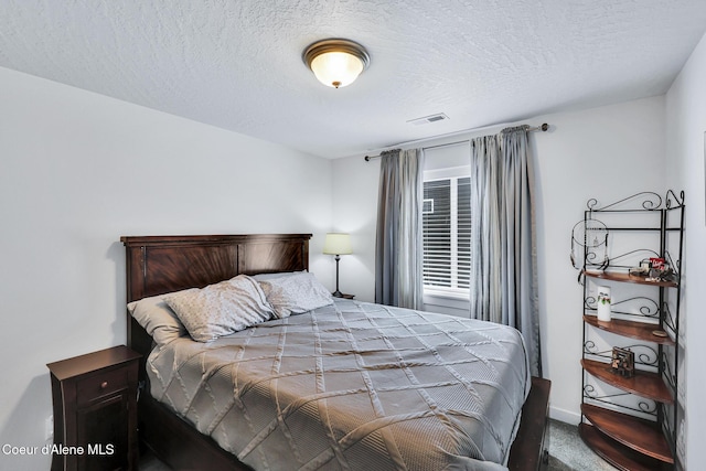 3631 N Britton Rd, Post Falls, ID 83854 - bedroom with carpet flooring and a textured ceiling