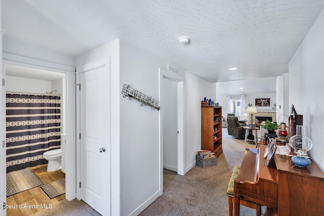 3631 N Britton Rd, Post Falls, ID 83854 - hallway featuring baseboards and a textured ceiling