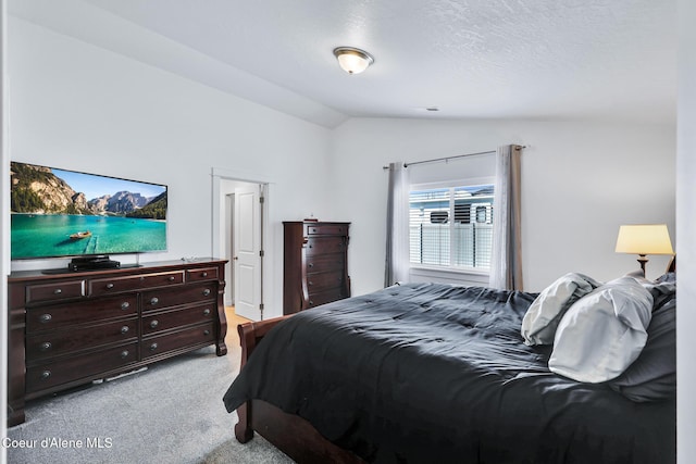 3631 N Britton Rd, Post Falls, ID 83854 - bedroom featuring vaulted ceiling and light colored carpet