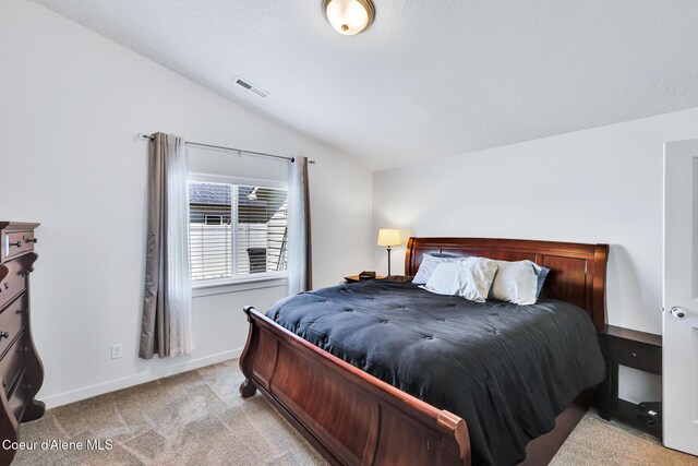 3631 N Britton Rd, Post Falls, ID 83854 - bedroom featuring vaulted ceiling and carpet flooring