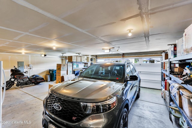 3631 N Britton Rd, Post Falls, ID 83854 - garage featuring electric panel and a garage door opener