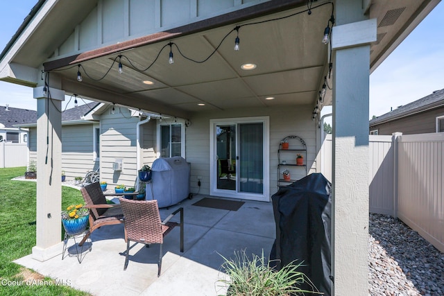 3631 N Britton Rd, Post Falls, ID 83854 - fenced backyard with a patio area