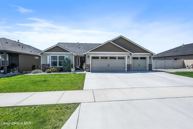 3631 N Britton Rd, Post Falls, ID 83854 - view of front of home with a garage, stone siding, and concrete driveway