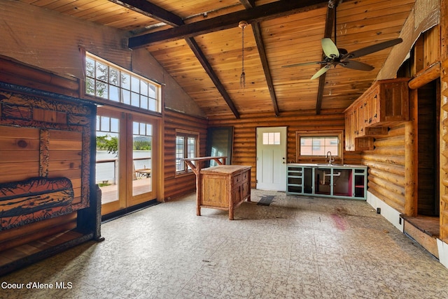 527 W Seneacquoteen, Priest River, ID 83856 - office with a wood ceiling with exposed beams, rustic walls, healthy amount of natural light, ceiling fan, and french doors