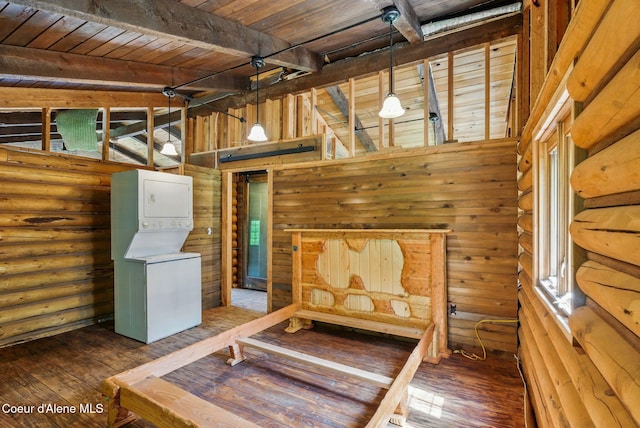 527 W Seneacquoteen, Priest River, ID 83856 - unfurnished bedroom with stacked washer / dryer, a wood ceiling with exposed beams, hardwood / wood-style flooring, and log walls