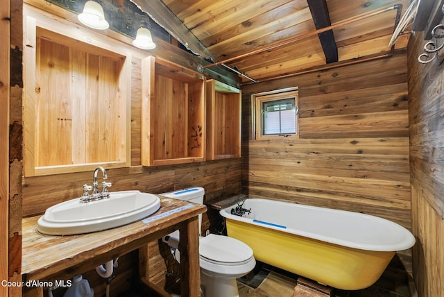 527 W Seneacquoteen, Priest River, ID 83856 - full bath featuring wooden walls, a freestanding tub, wooden ceiling, and vanity