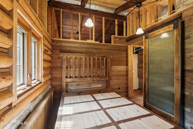 527 W Seneacquoteen, Priest River, ID 83856 - doorway with wood-type flooring, wood walls, log walls, and wooden ceiling