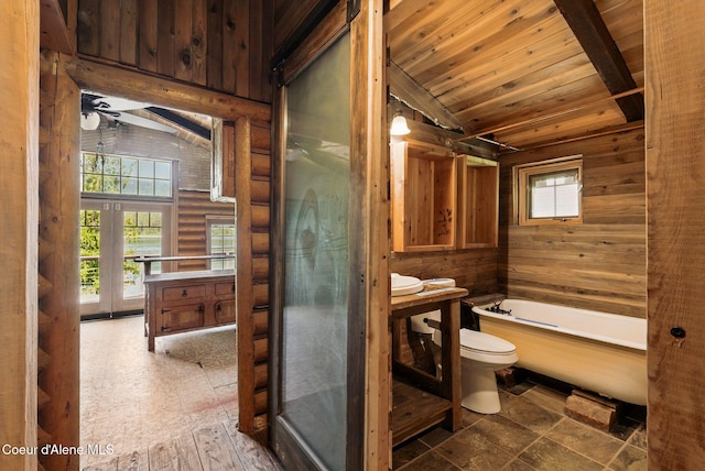 527 W Seneacquoteen, Priest River, ID 83856 - full bathroom featuring a tub to relax in, vaulted ceiling, vanity, wooden ceiling, and log walls
