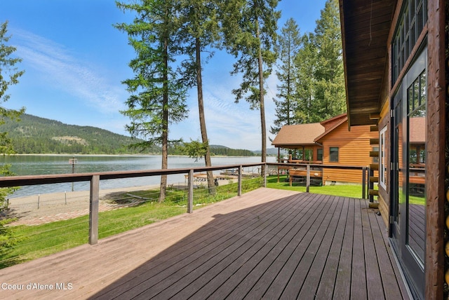 527 W Seneacquoteen, Priest River, ID 83856 - wooden terrace with a water view and a yard