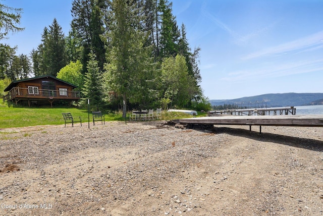 527 W Seneacquoteen, Priest River, ID 83856 - view of yard featuring a deck with water view