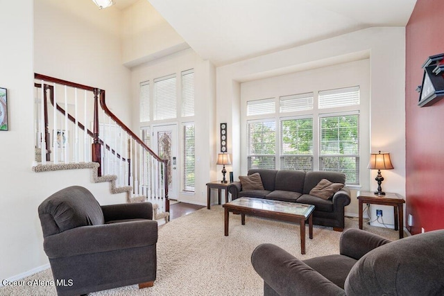 8136 Salmonberry Lp, Hayden, ID 83835 - living area featuring stairway and a towering ceiling