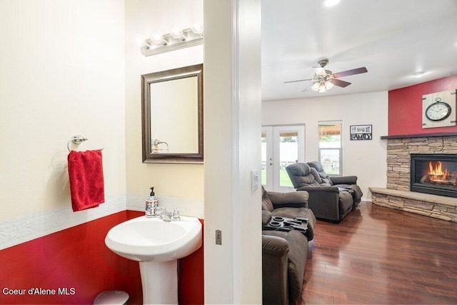 8136 Salmonberry Lp, Hayden, ID 83835 - bathroom with wood finished floors, french doors, a fireplace, and ceiling fan