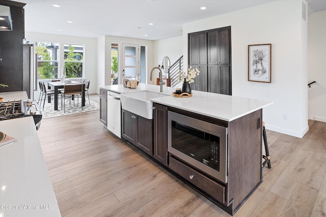 2756 W Lumber Ln Unit 7, Coeur Dalene, ID 83814 - kitchen featuring stainless steel microwave, dishwashing machine, dark brown cabinets, light countertops, and recessed lighting