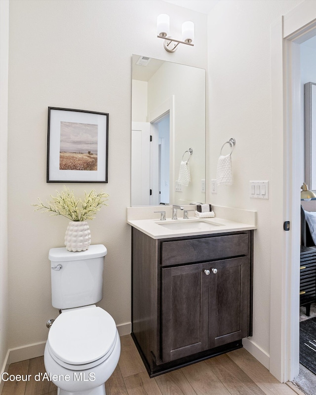 2756 W Lumber Ln Unit 7, Coeur Dalene, ID 83814 - bathroom with vanity and wood finished floors
