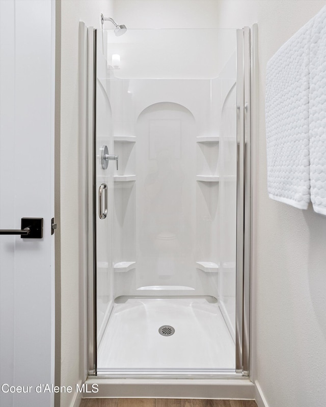 2756 W Lumber Ln Unit 7, Coeur Dalene, ID 83814 - full bath featuring a shower stall and baseboards