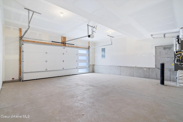 2756 W Lumber Ln Unit 7, Coeur Dalene, ID 83814 - garage featuring electric panel and a garage door opener