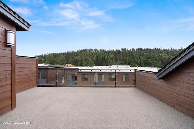 2756 W Lumber Ln Unit 7, Coeur Dalene, ID 83814 - view of patio / terrace featuring a view of trees