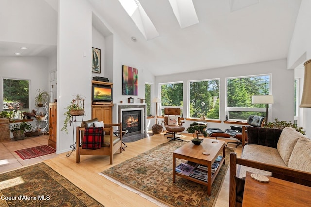38 S Quail Run Unit B, Sandpoint, ID 83864 - living room featuring high vaulted ceiling, a fireplace with flush hearth, plenty of natural light, light wood-style floors, and recessed lighting
