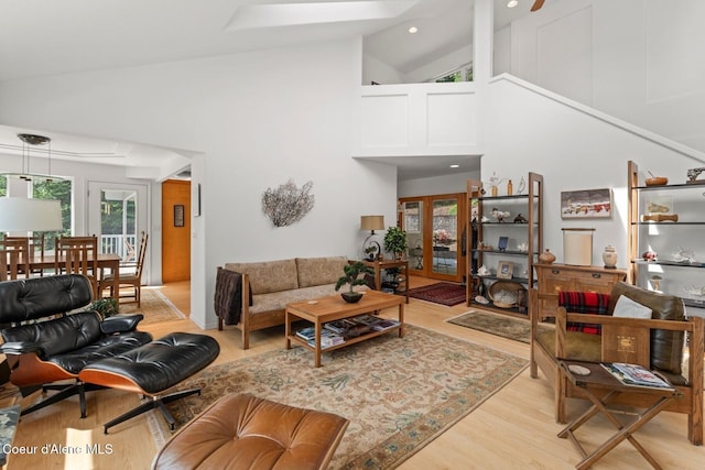 38 S Quail Run Unit B, Sandpoint, ID 83864 - living area with light wood-type flooring, high vaulted ceiling, recessed lighting, and french doors