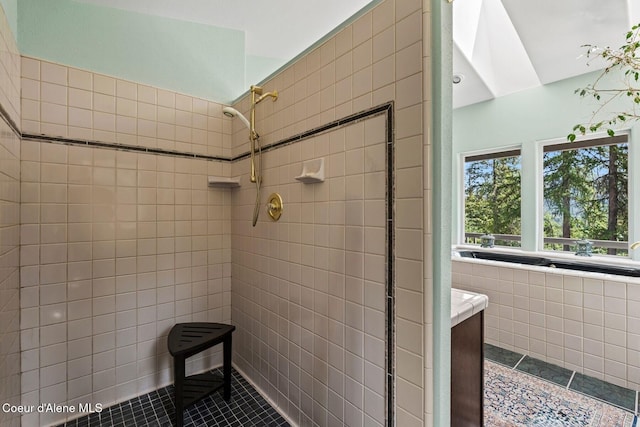 38 S Quail Run Unit B, Sandpoint, ID 83864 - full bath with tile patterned flooring, a tile shower, and tile walls