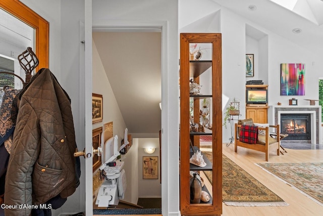 38 S Quail Run Unit B, Sandpoint, ID 83864 - hallway with wood finished floors, lofted ceiling, and a skylight