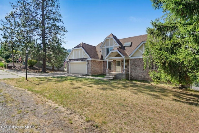 2699 E Packsaddle Dr, Coeur Dalene, ID 83815 - view of front facade featuring concrete driveway, a front yard, a garage, and brick siding