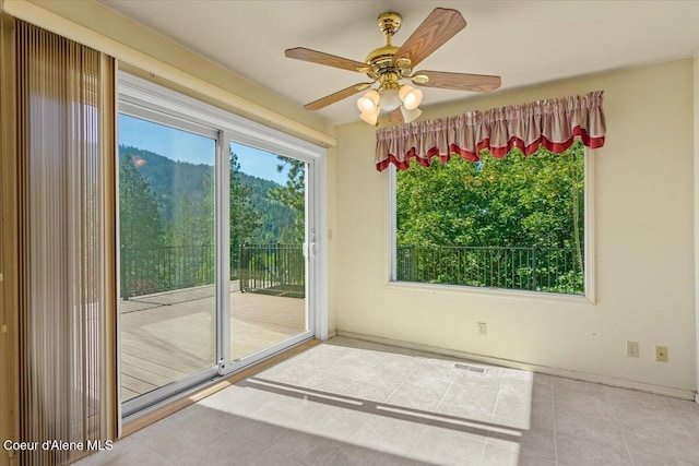 2699 E Packsaddle Dr, Coeur Dalene, ID 83815 - tiled spare room with a ceiling fan and baseboards