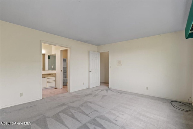 2699 E Packsaddle Dr, Coeur Dalene, ID 83815 - unfurnished bedroom featuring light carpet and connected bathroom