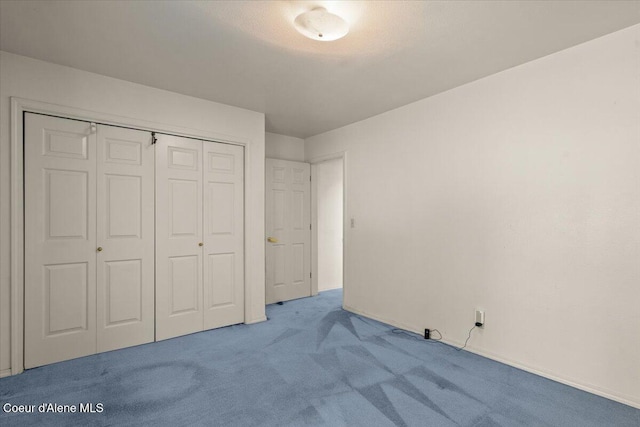 2699 E Packsaddle Dr, Coeur Dalene, ID 83815 - unfurnished bedroom with carpet floors and a closet