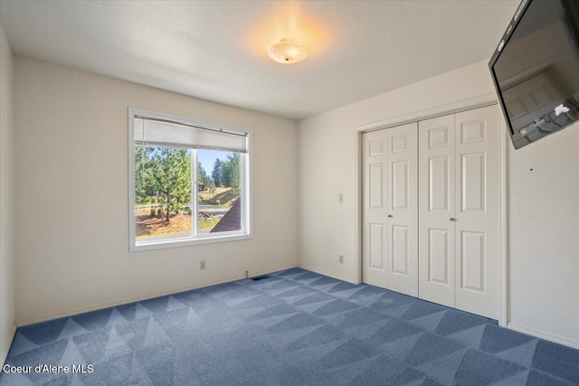 2699 E Packsaddle Dr, Coeur Dalene, ID 83815 - unfurnished bedroom with carpet floors and a closet