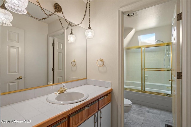2699 E Packsaddle Dr, Coeur Dalene, ID 83815 - full bath with a skylight, vanity, and shower / bath combination with glass door