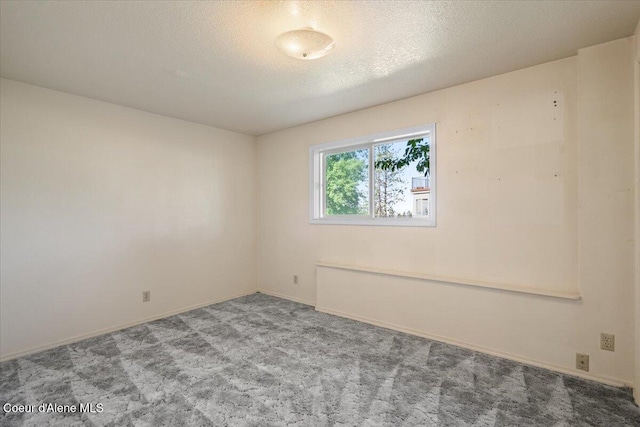 2699 E Packsaddle Dr, Coeur Dalene, ID 83815 - empty room featuring carpet flooring and a textured ceiling