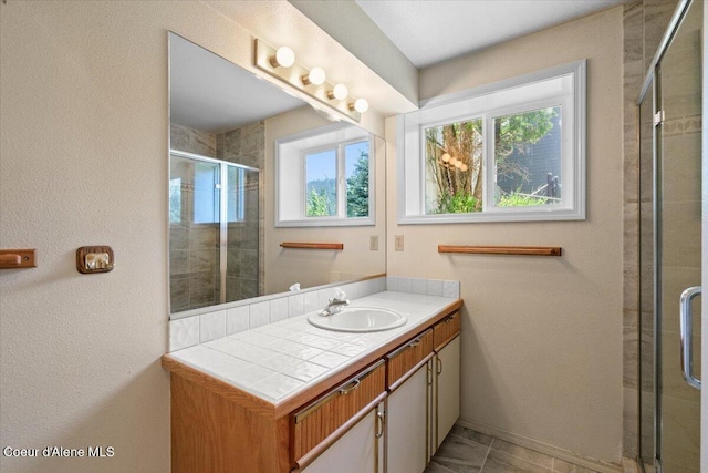 2699 E Packsaddle Dr, Coeur Dalene, ID 83815 - bathroom with vanity and a tile shower