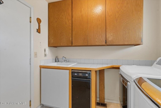 2699 E Packsaddle Dr, Coeur Dalene, ID 83815 - washroom with washer and dryer and cabinet space