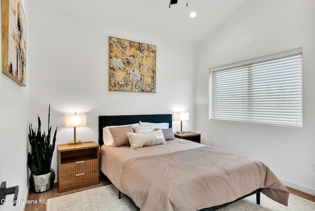 114 E Hattie, Coeur Dalene, ID 83814 - bedroom with vaulted ceiling, wood finished floors, and recessed lighting