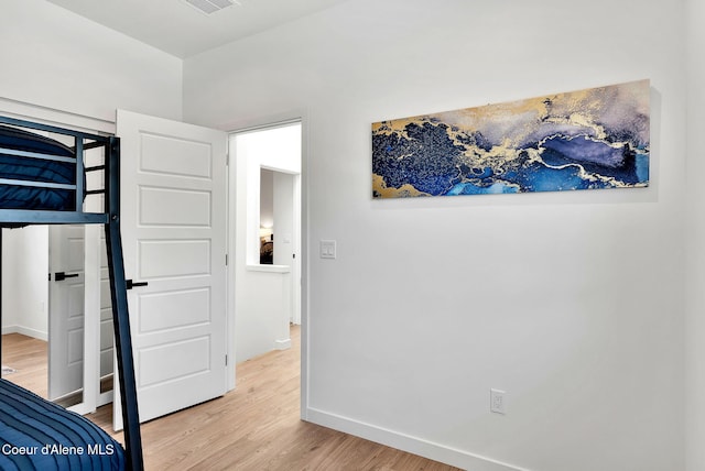 114 E Hattie, Coeur Dalene, ID 83814 - bedroom featuring light wood-style flooring and baseboards