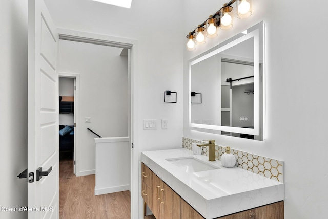114 E Hattie, Coeur Dalene, ID 83814 - bathroom with wood finished floors and vanity