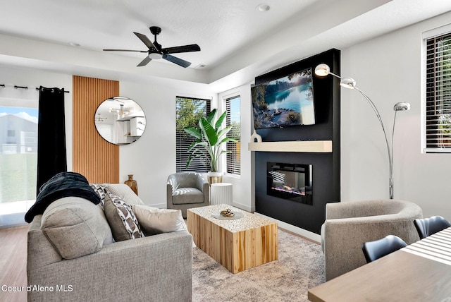 114 E Hattie, Coeur Dalene, ID 83814 - living area with a ceiling fan, a glass covered fireplace, and healthy amount of natural light