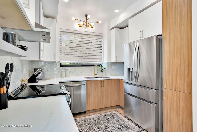114 E Hattie, Coeur Dalene, ID 83814 - kitchen featuring appliances with stainless steel finishes, a chandelier, decorative backsplash, and white cabinets