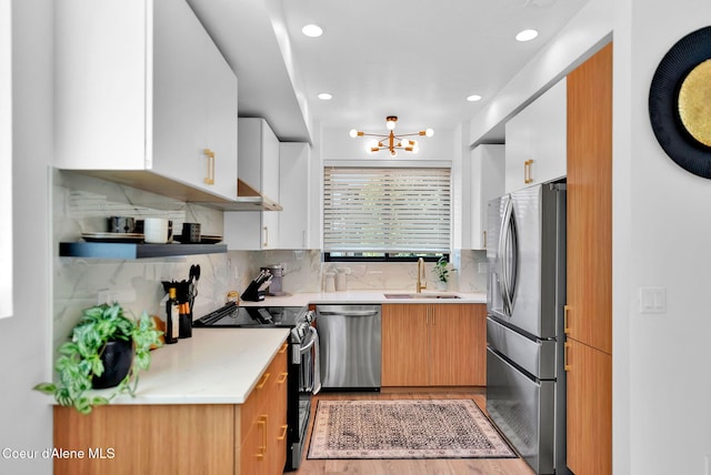 114 E Hattie, Coeur Dalene, ID 83814 - kitchen featuring stainless steel appliances, light countertops, light wood-style flooring, tasteful backsplash, and recessed lighting