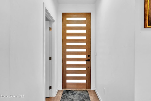 114 E Hattie, Coeur Dalene, ID 83814 - doorway featuring light wood finished floors and baseboards