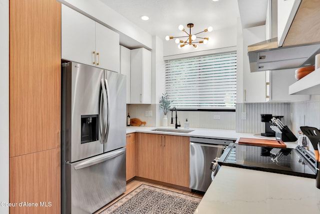 114 E Hattie, Coeur Dalene, ID 83814 - kitchen with appliances with stainless steel finishes, extractor fan, a chandelier, and white cabinetry