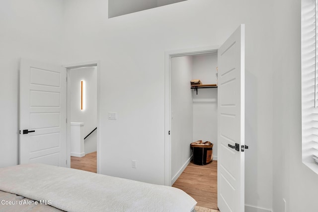 114 E Hattie, Coeur Dalene, ID 83814 - bedroom featuring wood finished floors, a spacious closet, and a closet