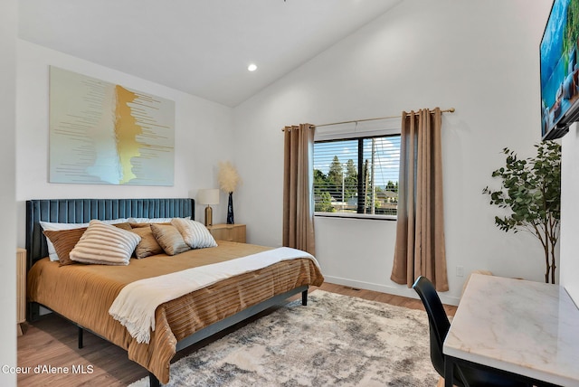 114 E Hattie, Coeur Dalene, ID 83814 - bedroom with high vaulted ceiling, wood finished floors, and recessed lighting