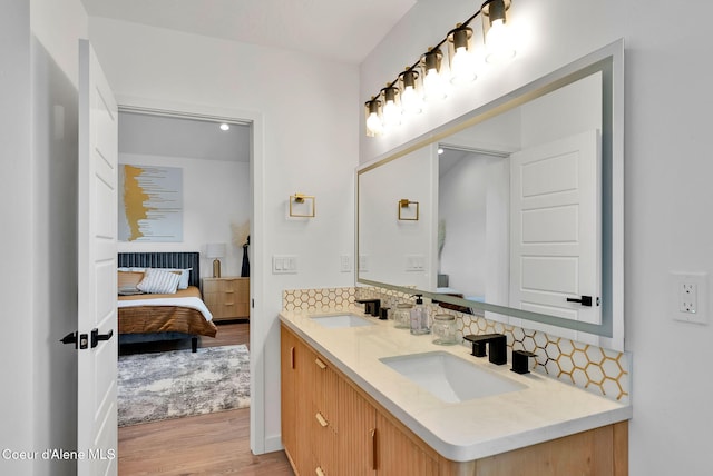 114 E Hattie, Coeur Dalene, ID 83814 - full bath featuring double vanity, tasteful backsplash, ensuite bath, and wood finished floors