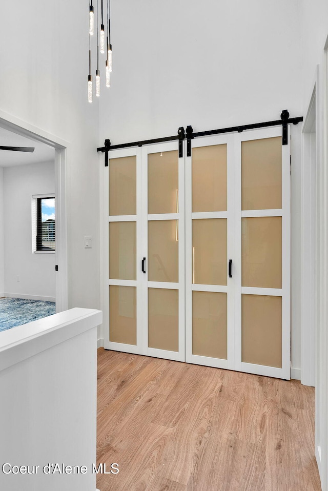 114 E Hattie, Coeur Dalene, ID 83814 - detailed view of wood finished floors and a barn door