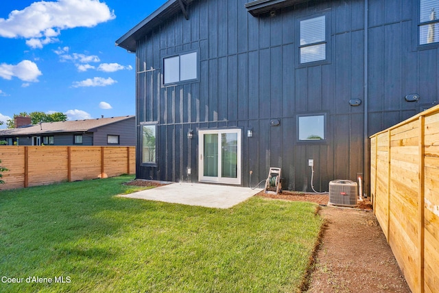 114 E Hattie, Coeur Dalene, ID 83814 - rear view of property with board and batten siding, a patio area, and a fenced backyard