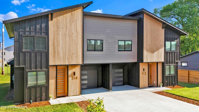 114 E Hattie, Coeur Dalene, ID 83814 - contemporary home featuring concrete driveway and an attached garage